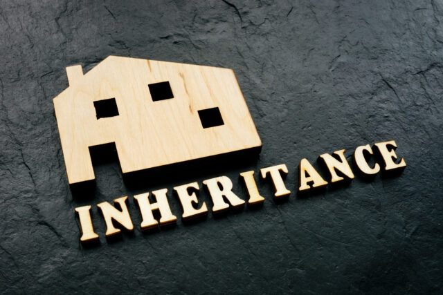 Wooden home as symbol of property and word inheritance.